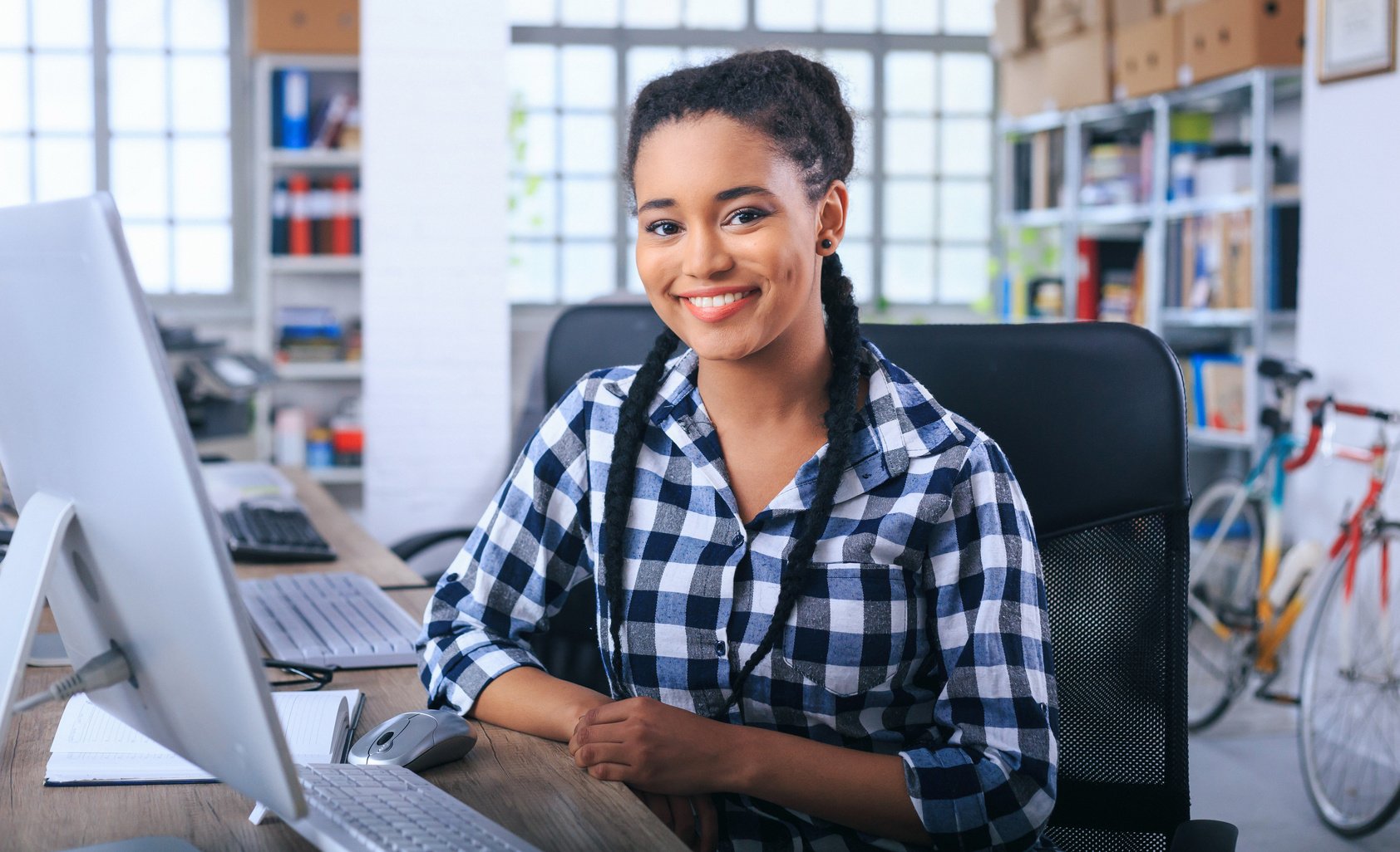 Smiling african office assistant